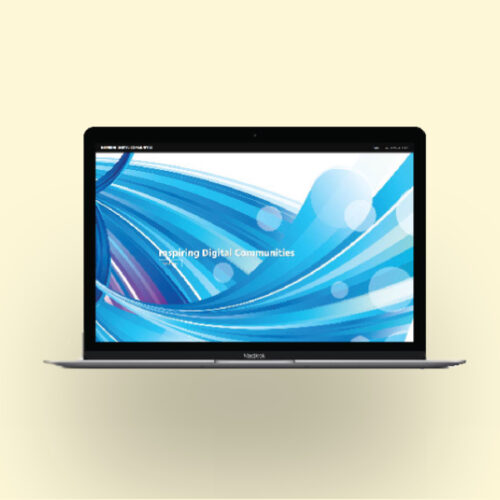 laptop on cream background showing Stanford Marketing work.